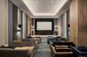 Home theater with a raised ceiling