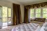 Bedroom featuring wood finished floors and access to outside
