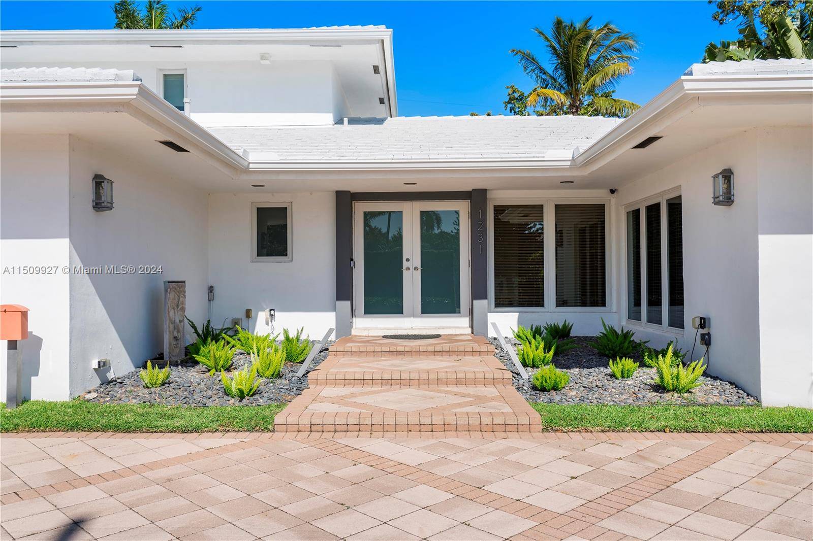 An absolutely gorgeous chic home on prestigious Bay Harbor Islands.