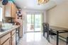Sliding glass doors off the kitchen to the balcony