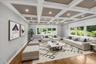 Second Living Room with beautifully decorated ceilings featuring recessed lighting, second fire-place and large windows throughout. Furniture has been