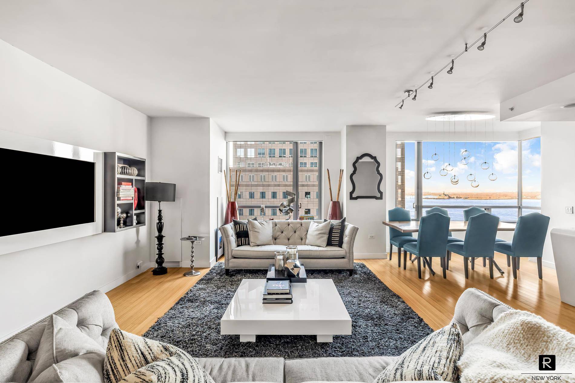 Exquisite Hudson River views and spacious layout in this three bed three bath home in the Riverhouse, the only waterfront LEED certified Green condominium in North Battery Park West Tribeca.