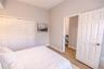 Light filled bedroom with generous storage and easy access to a full bath.