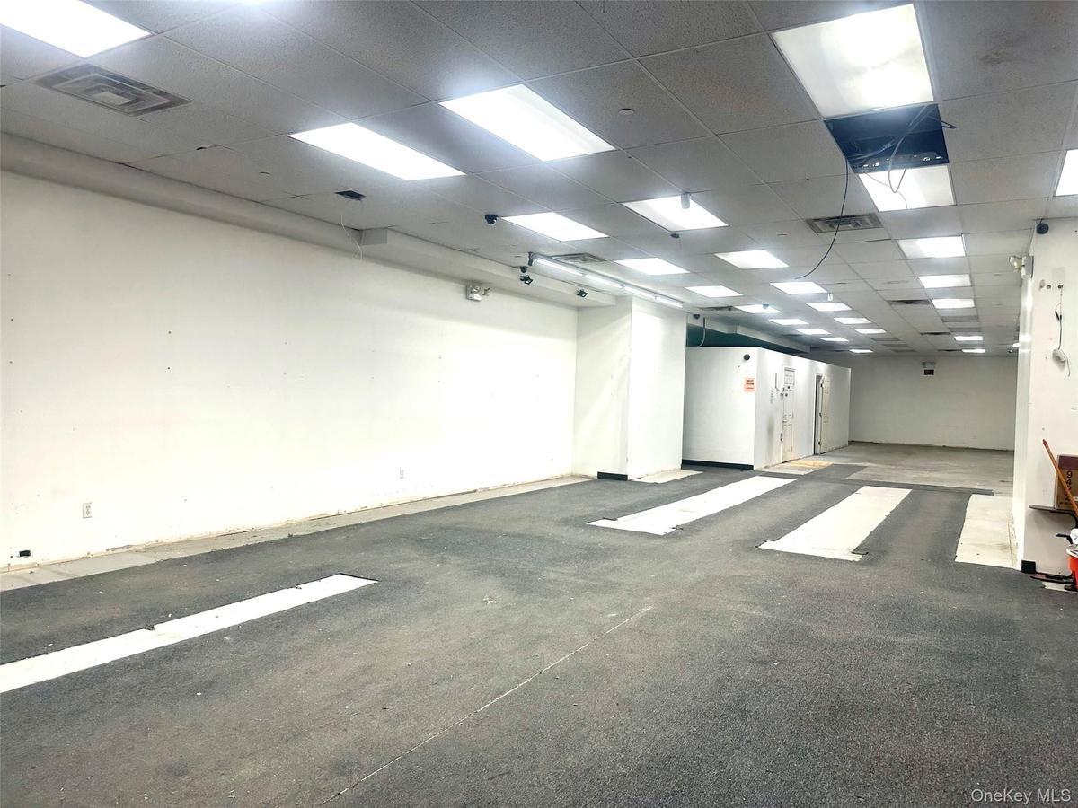 Unfurnished room featuring a drop ceiling