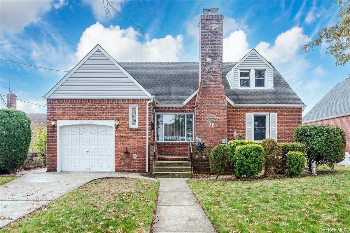 Beautiful Brick Cape Featuring 4 Bedrooms and 2 Full Baths.