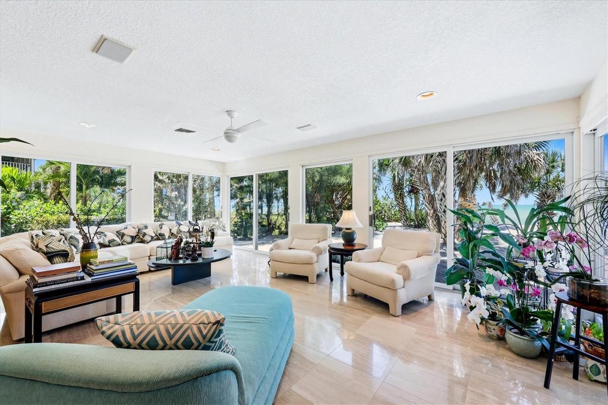Extended living room/family room has panoramic views overlooking the Gulf
