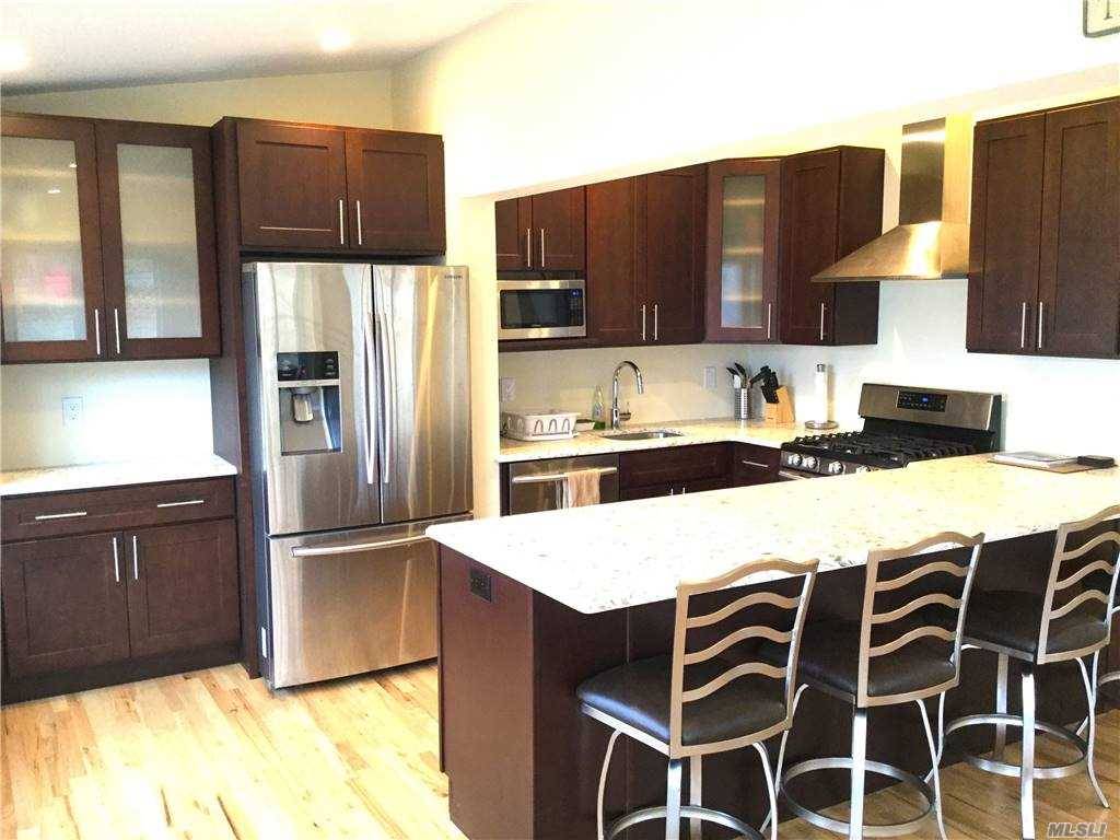 This 2 bedroom, 1 bath unit, recently updated, features a chef's kitchen with stainless steel appliances, and granite counter.