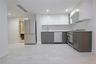 Kitchen featuring modern cabinets, white cabinets, appliances with stainless steel finishes, under cabinet range hood, and recessed lighting