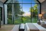 Second floor primary bedroom with stunning floor to ceiling windows and water views