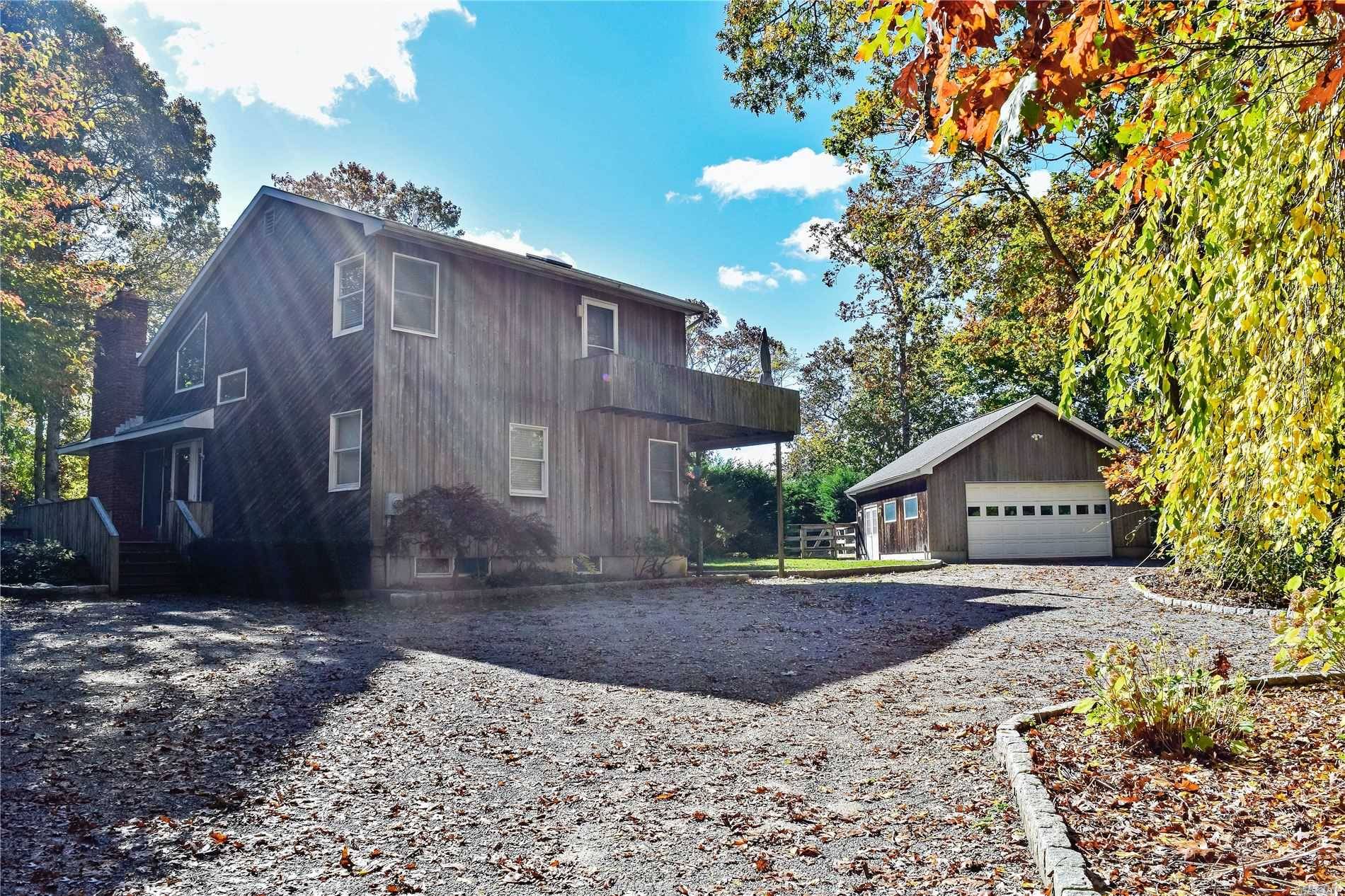 Set on 1. 1 acres down in a private flag lot, sits a well maintained 3 bedroom 2 bath contemporary saltbox featuring high ceilings, wood floors throughout, a wood burning ...