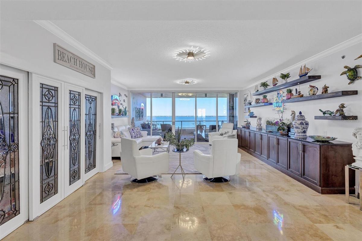 Custom closet with leaded glass crystal panels Ample shelving and storage throughout unit