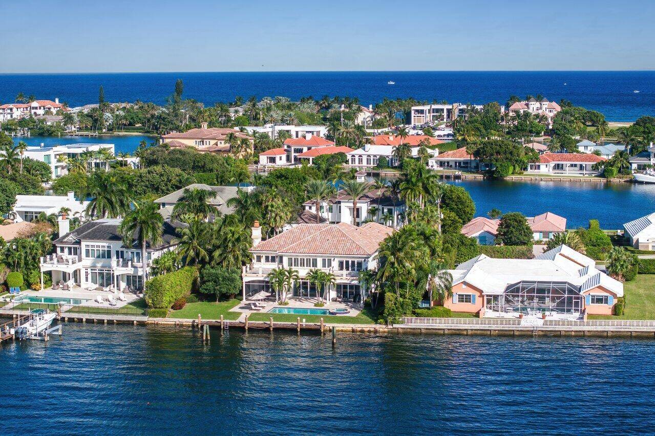 Exquisite 2 story Mediterranean waterfront home in secure, exclusive Manalapan Built by the famed luxury Hampton builder Farrell, this incredible 6, 214 SF home has 5 BR and 6.