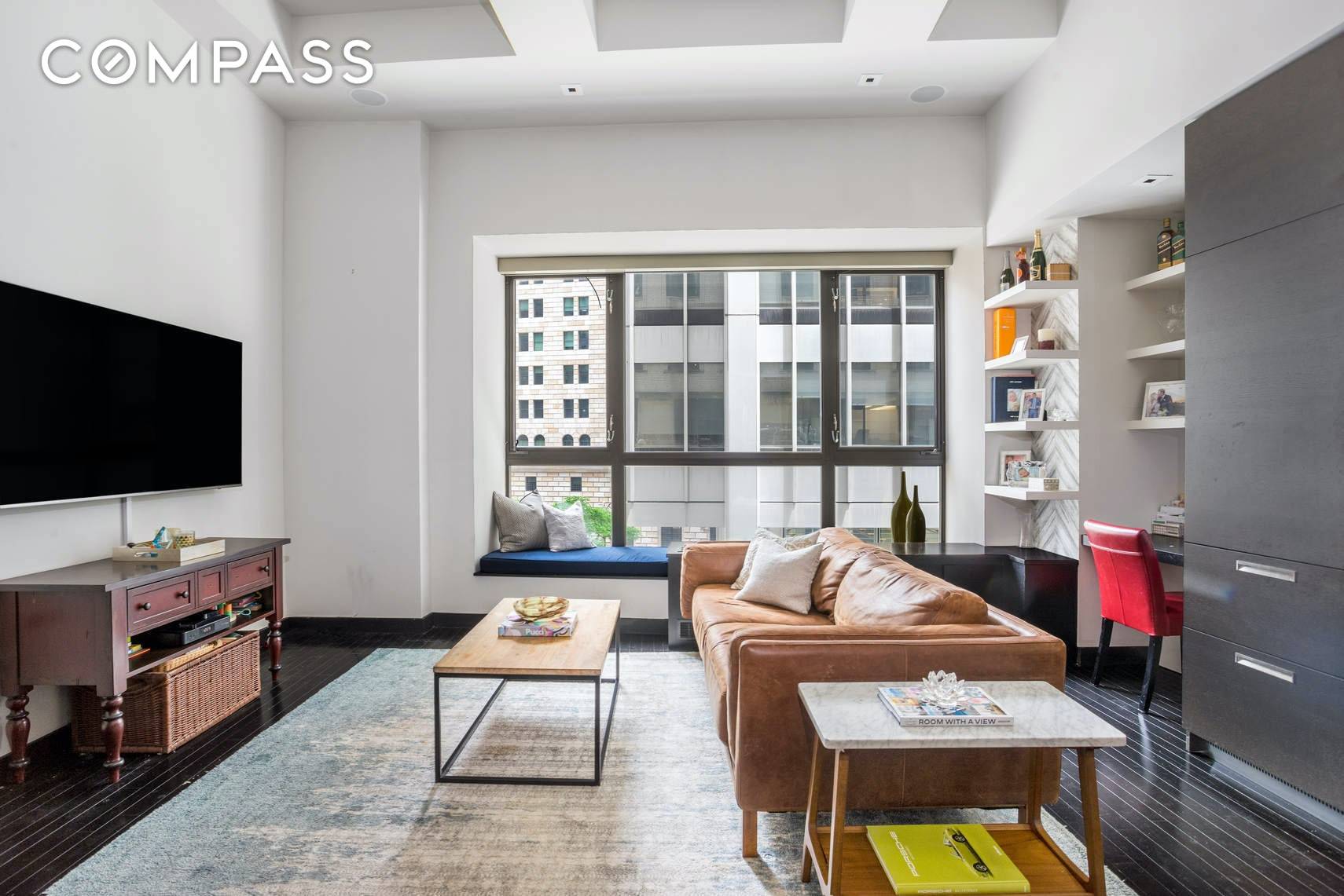 Step into this meticulously designed, light filled one bedroom with a home office and two full bathrooms in one of Downtown's greatest buildings.