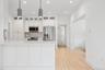 Kitchen featuring recessed lighting, light countertops, baseboards, and stainless steel appliances