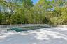 Wooden deck with view of wooded area