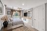 Built-in entertainment center with open shelving and wood-finish countertop