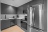 Kitchen featuring modern cabinets, appliances with stainless steel finishes, recessed lighting, and light wood finished floors