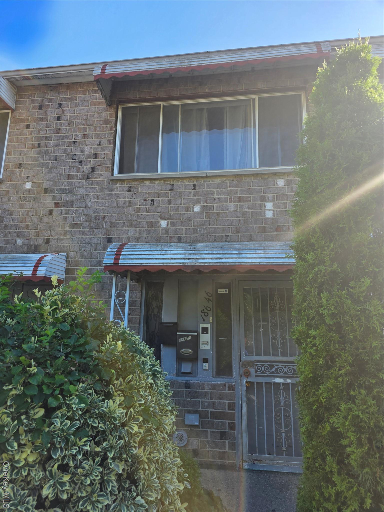 View of front of house featuring brick siding