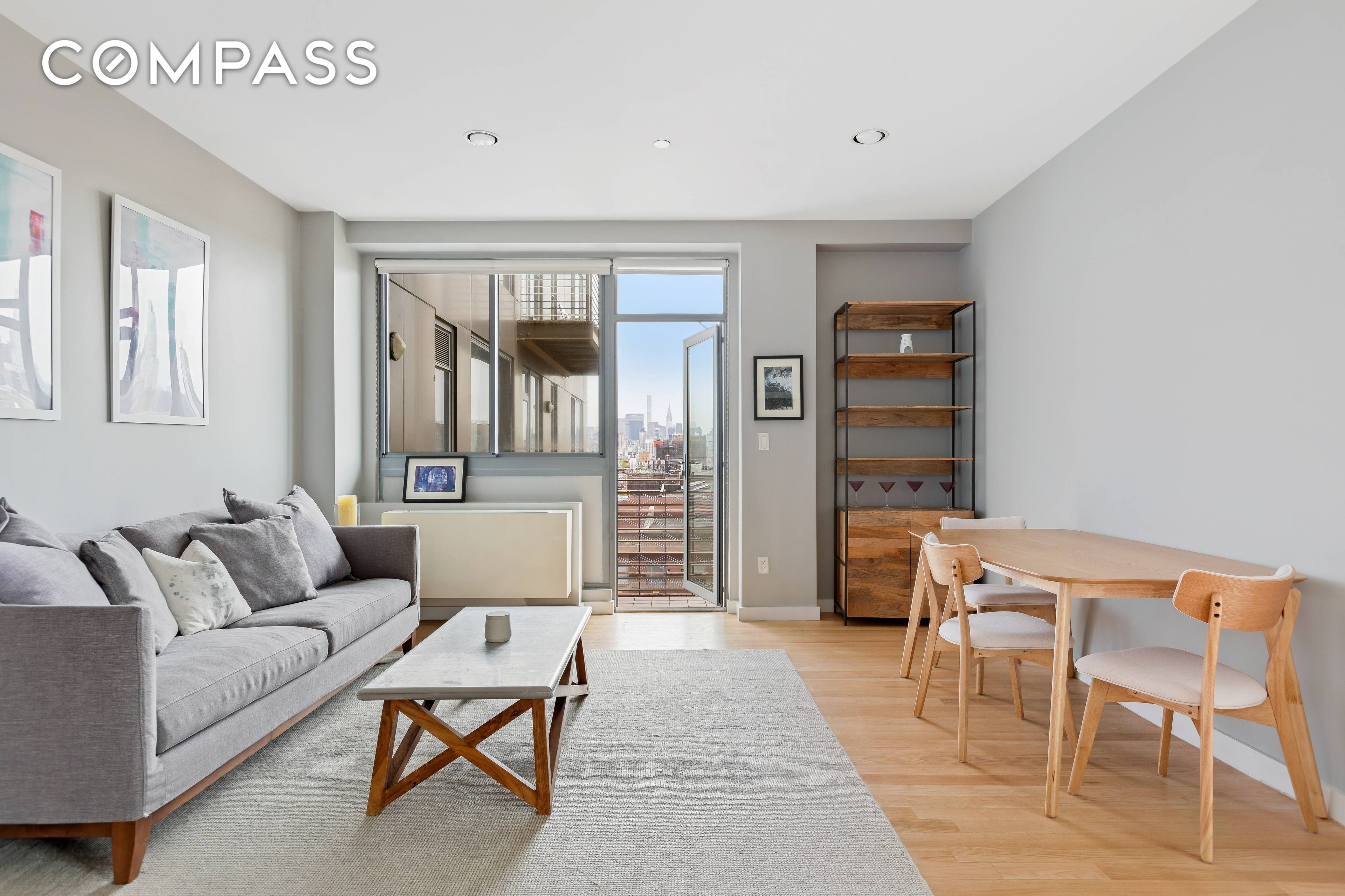 Rare and coveted corner A line apartment with a private balcony, now available at the full service Delancey Towers condominium on Manhattan s prime Lower East Side !