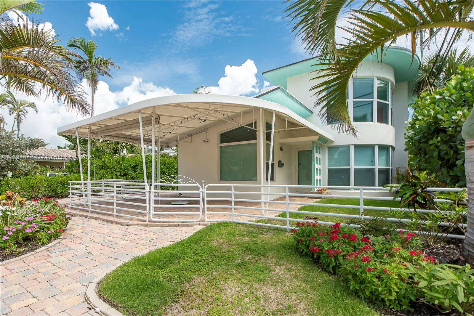 This furnished restored architectural gem is a tropical seaside paradise !