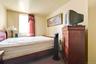 Bedroom with dark carpet