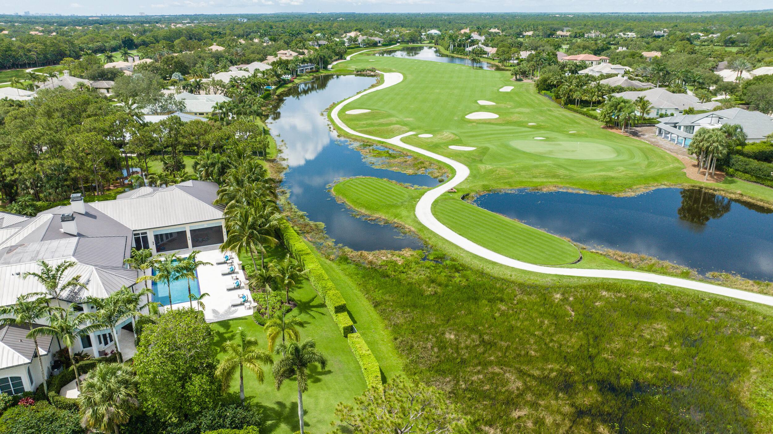 Exquisite custom estate in the award winning, gated golf community of Old Marsh Golf Club.