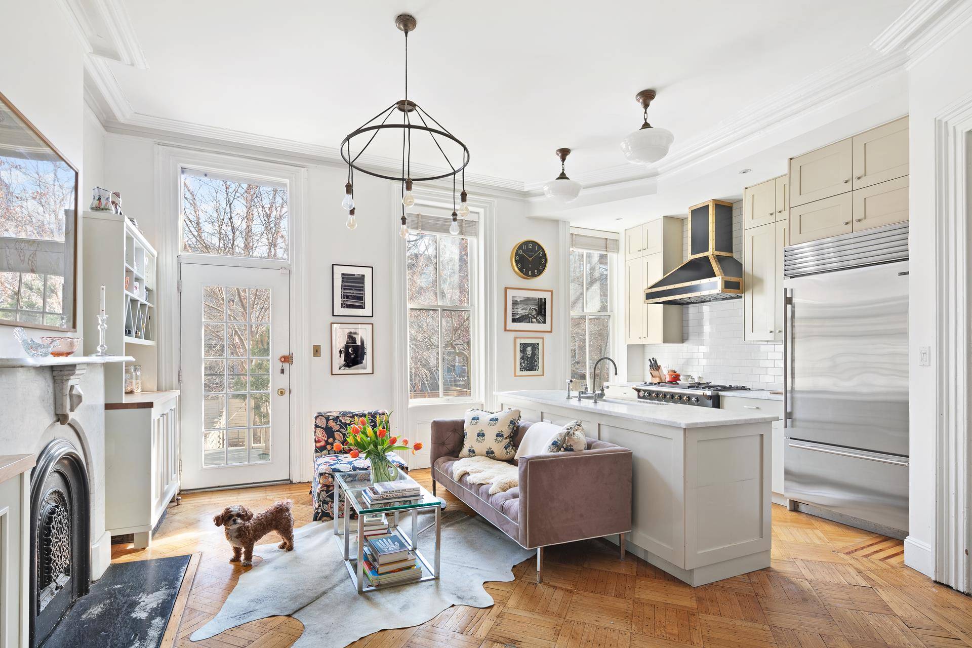 This happy and bright, well preserved two family Clinton Hill townhouse emanates charm.