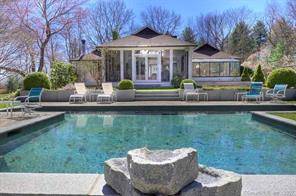 Mint St. Barth's style home in perfect hilltop neighborhood with heated pool.