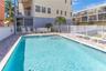 Relax at your quaint communities private pool oasis.