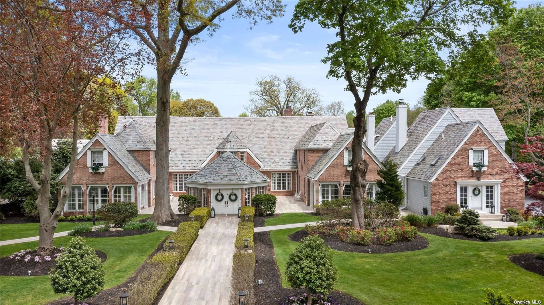 SWAN MANOR ! Perfectly Situated On Just Over Nine Lush Private Acres In The Heart Of Nissequogue Lies This Magnificent Gated Estate With Grand Scale Elegance.
