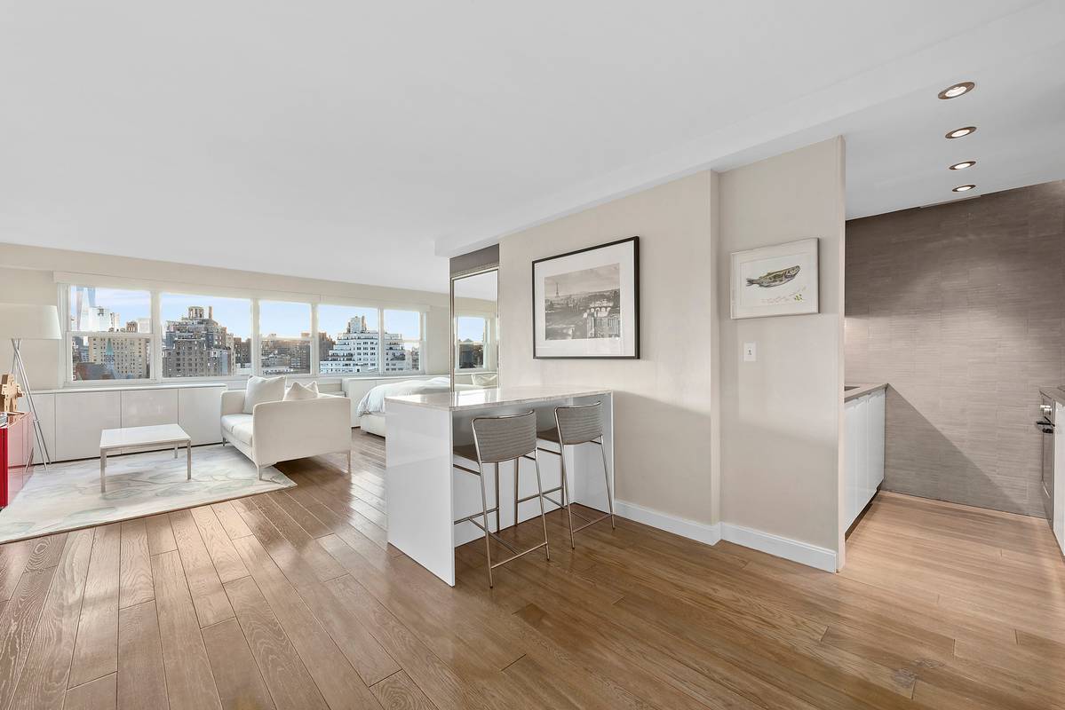 High above the landmarked blocks of the West Village, this spacious alcove studio features open plan living in one of Manhattan's finest co ops.