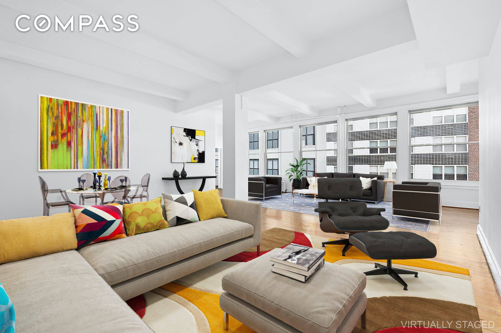 Welcome home to this dramatic and expansive Chelsea loft with 50 feet of oversized windows and splashed with sunshine.