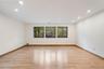 Spacious interior featuring wood-finish flooring, recessed lighting, and a neutral color palette