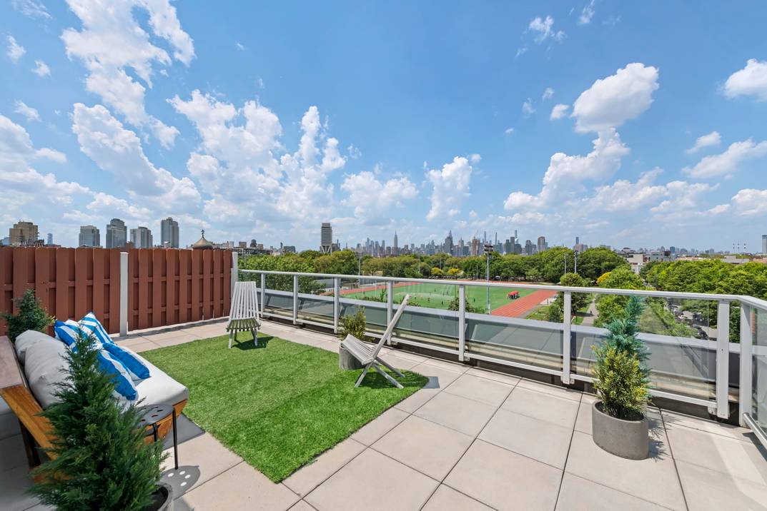 STUNNING Loft like 3 Bedroom, 2 Bath corner duplex apartment with a MASSIVE wrap around private terrace that features abundant streaming natural light from 3 exposures with direct unobstructed McCarren ...