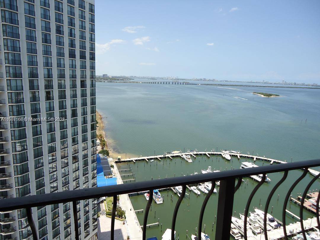 BEAUTIFUL 1 1 1 WITH PANORAMIC WATER VIEWS OF BISCAYNE BAY AND OCEAN.