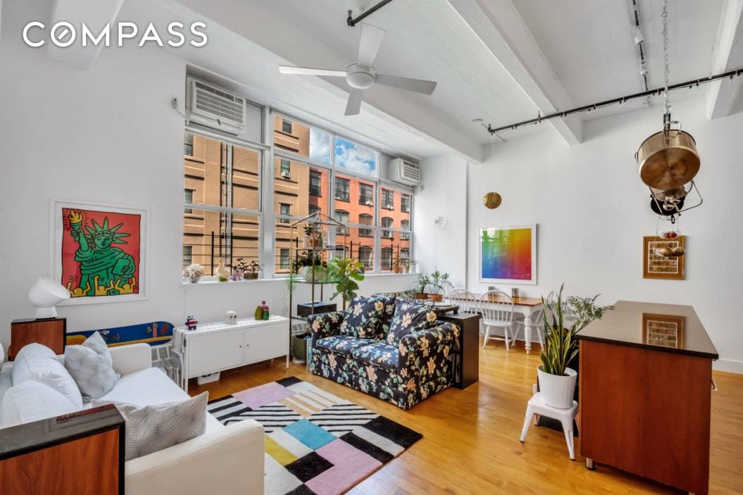 3D TOUR WITHIN. A voluminous two bedroom, two bathroom loft with soaring 14' poured concrete beamed ceilings in a full service Clinton Hill condominium.