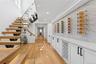Wine area featuring light wood-type flooring and recessed lighting