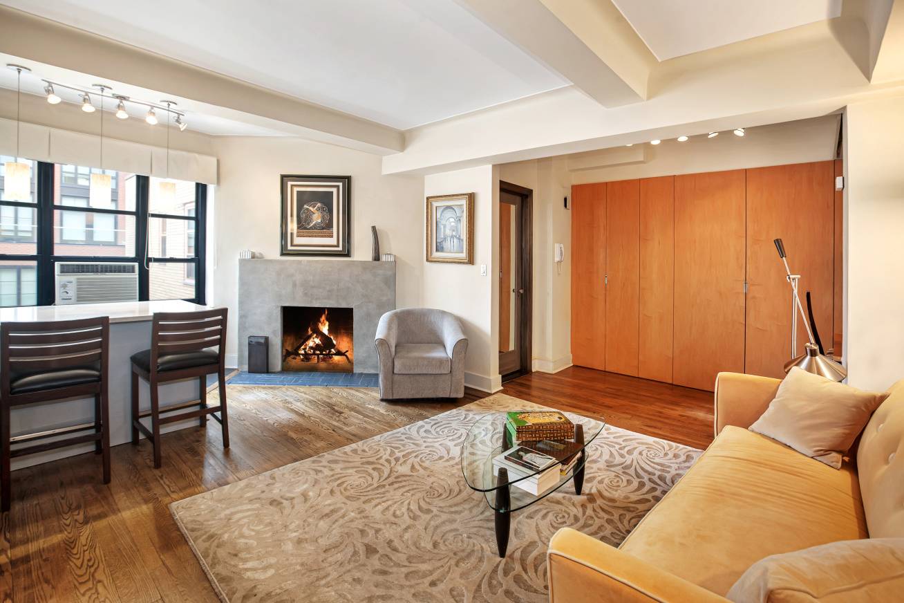 A very special large studio apartment with a wood burning fireplace on the top floor of Gramercy House, the highly sought after Art Deco coop on East 22nd Street a ...