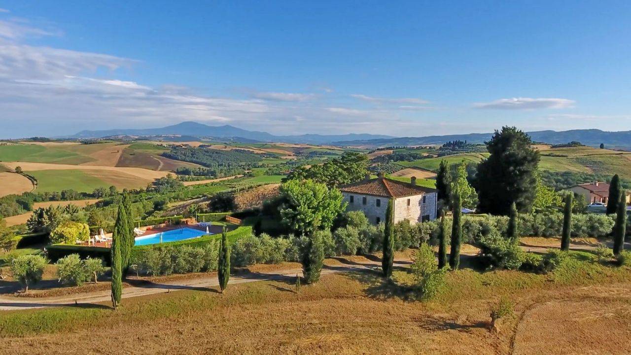 Farm with agriturismo, farmhouse, wine cellar, vineyard and olive grove for sale in Montalcino, Tuscany.
