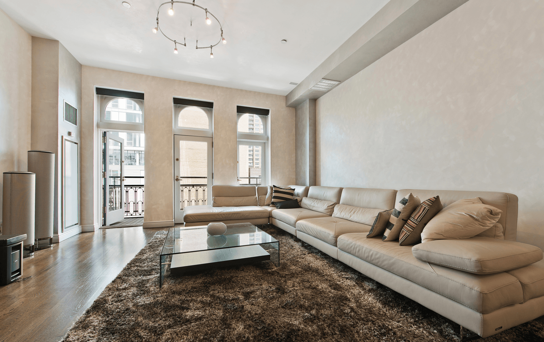 Enter this dramatic Penthouse loft to extra high ceilings and a stunning floating glass staircase.
