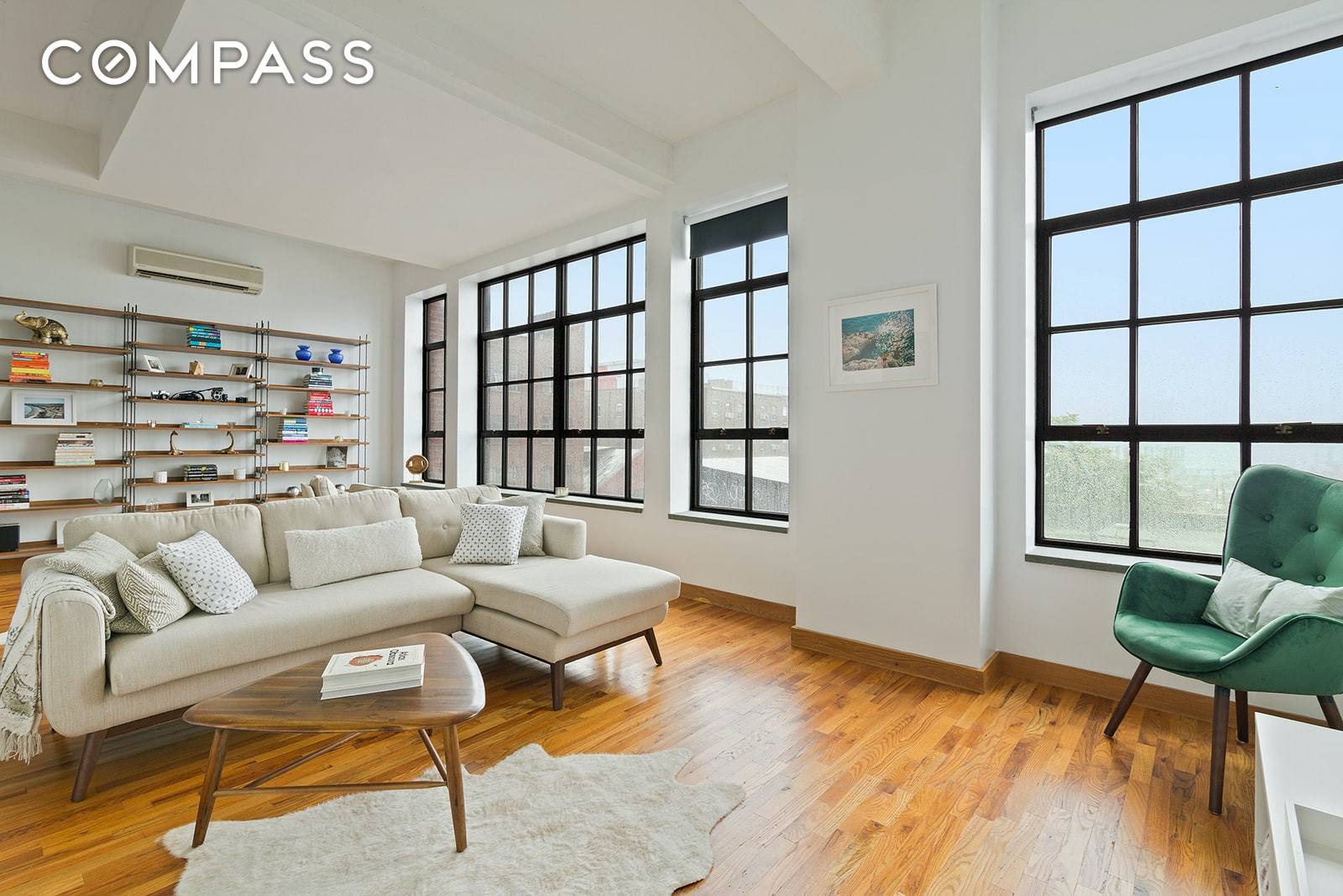 This convertible two bedroom loft has Manhattan and East River views flooding the apartment with natural light.