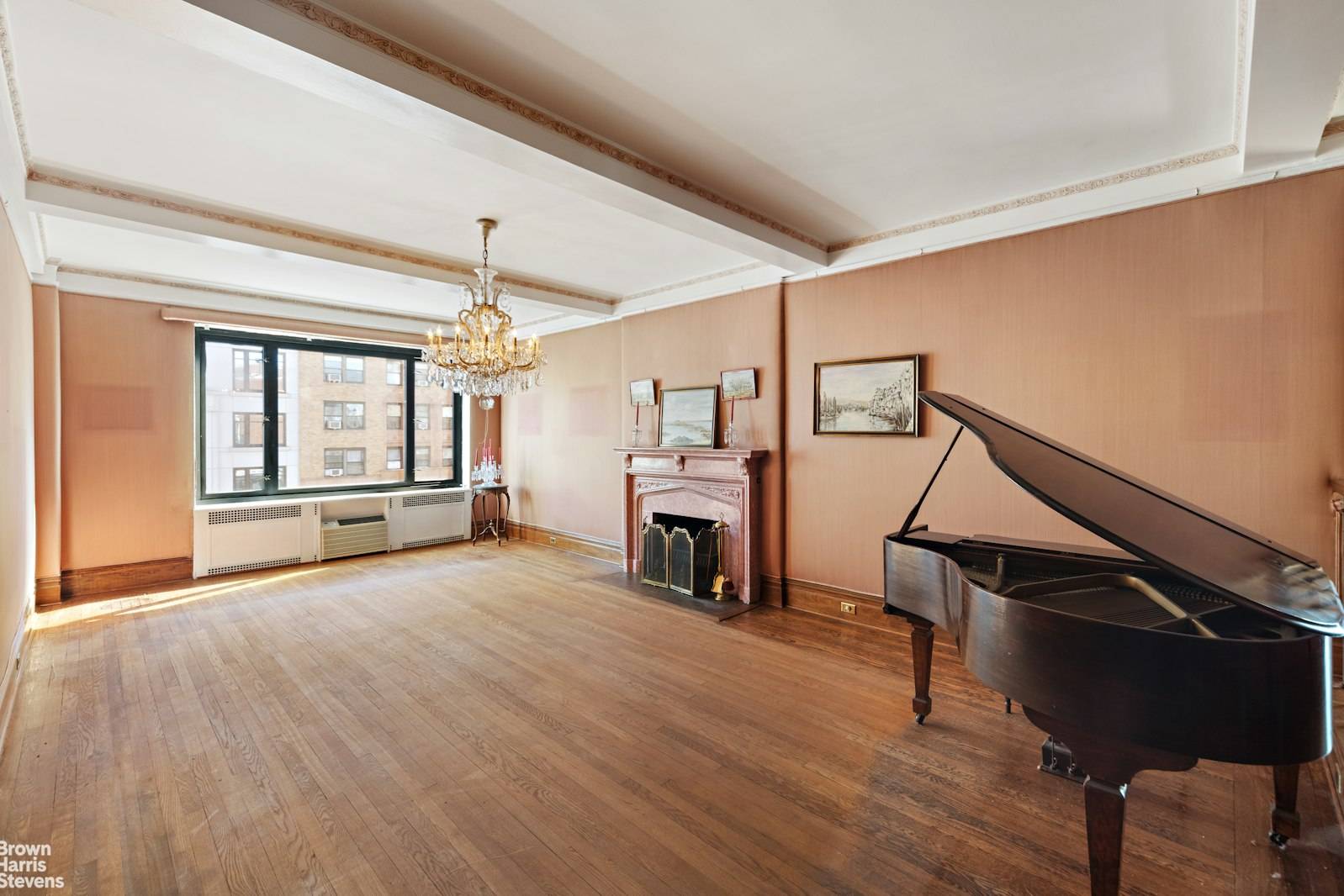 This spacious residence has the charm of the prewar building with all the preserved details, beamed high ceilings, beautiful hardwood floors, steel door frames.