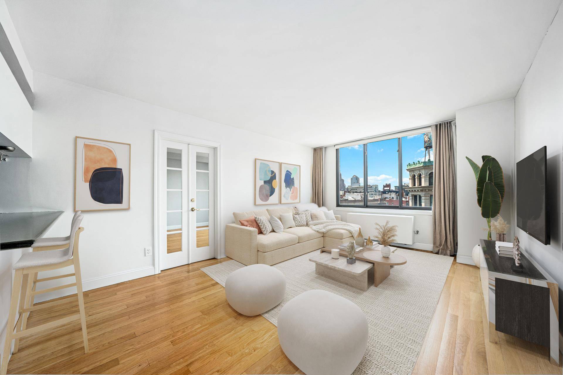 One of a kind and rarely available oversized two bedroom two bathroom residence in a full service luxury doorman building in the heart of Nolita, where Bowery meets Spring Street.