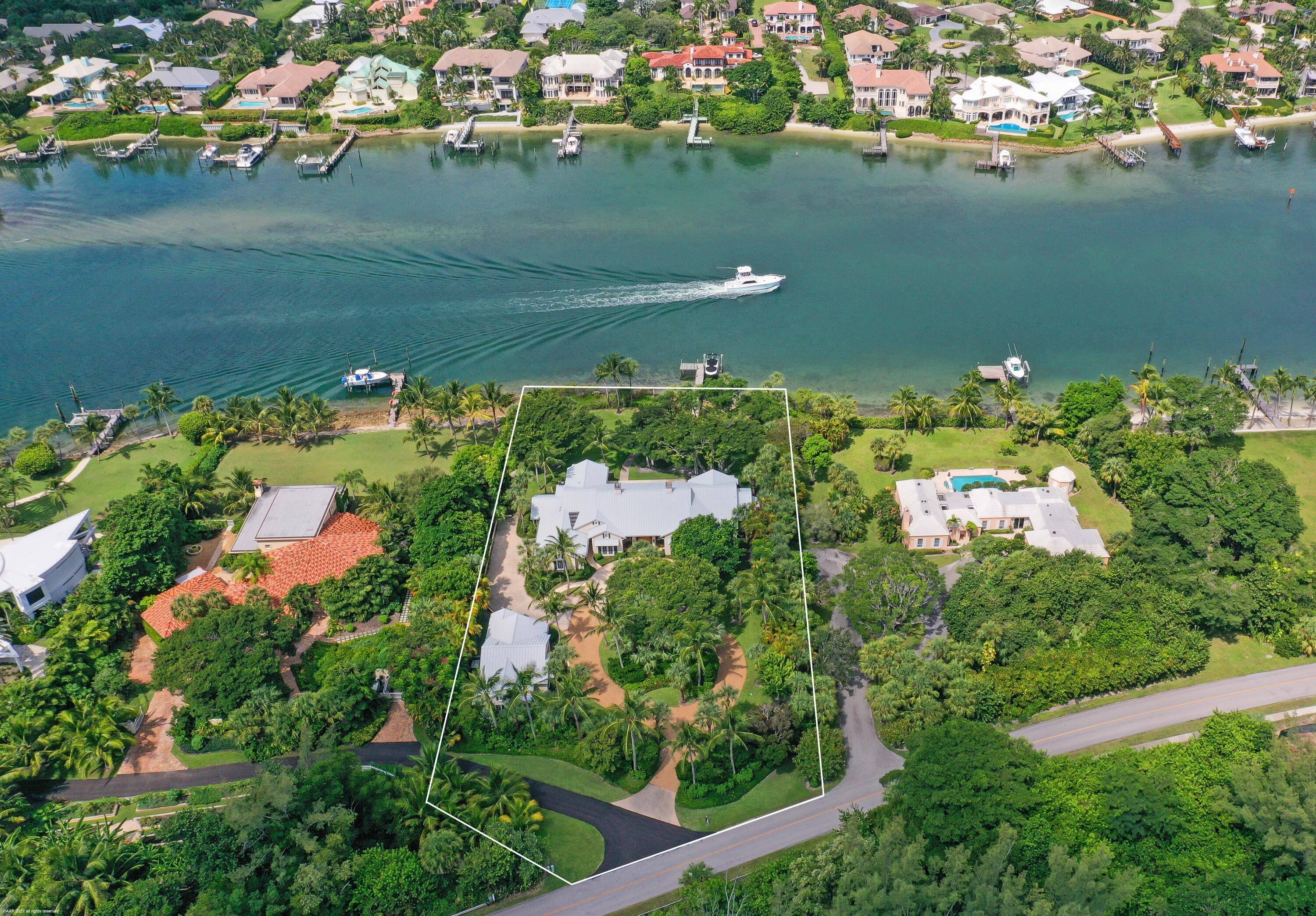 A Spectacular Island Style home, on the Intracoastal Waterway, creates a personal Jupiter Island paradise !