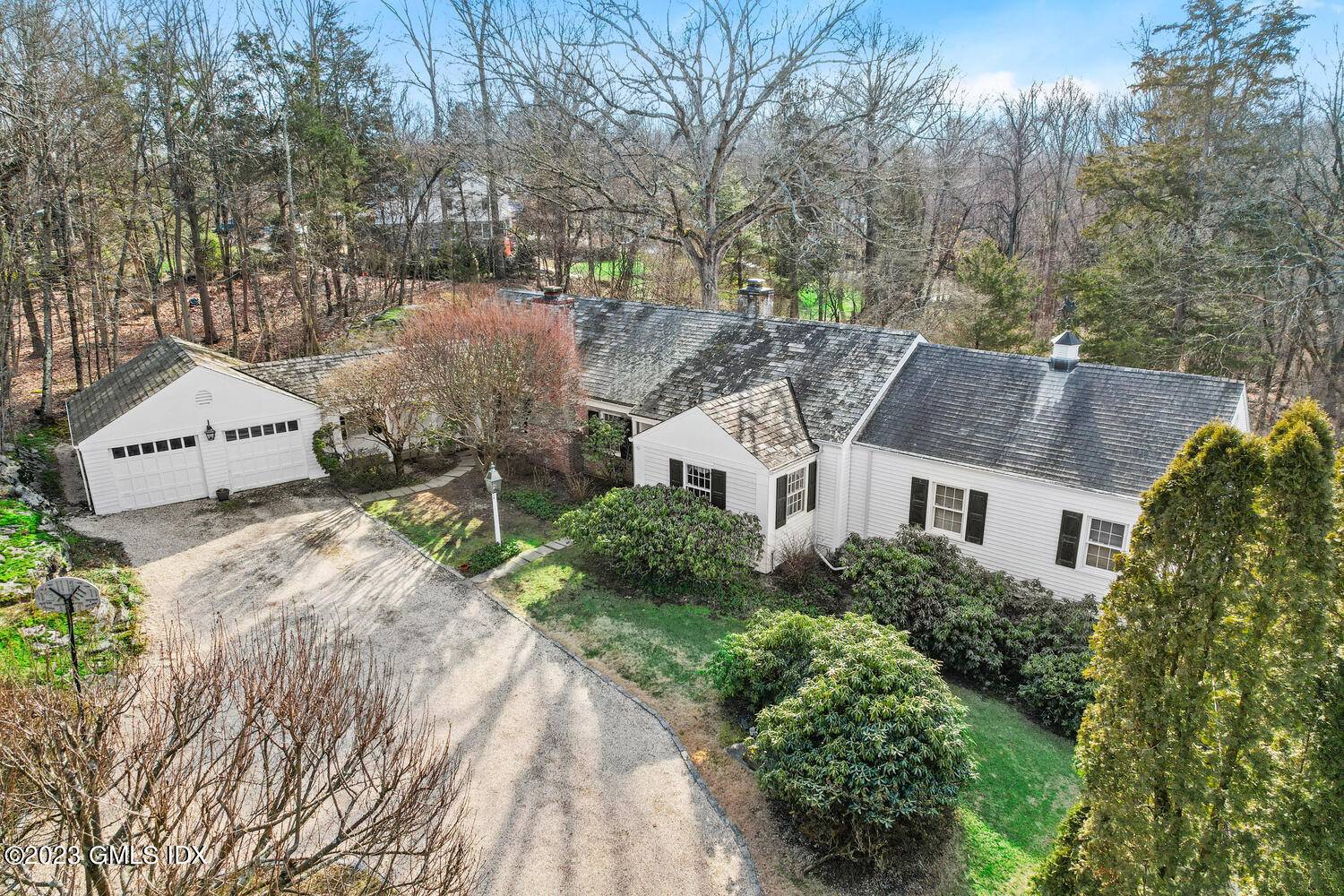 Private, 3, 787 sf home on 2 acres in north Cos Cob with two flat lawn areas bordered by historic stone walls.