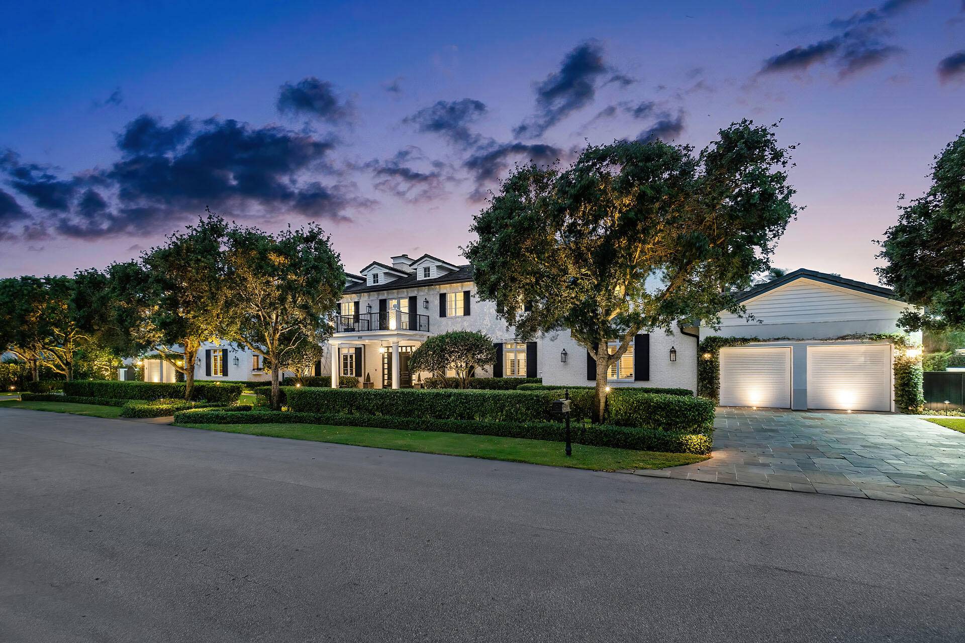 2333 Acorn Palm Road is a stately residence that seems plucked from the idyllic charm of the Hamptons, a masterpiece conceived by Tuthill Architecture and brought to life by B ...