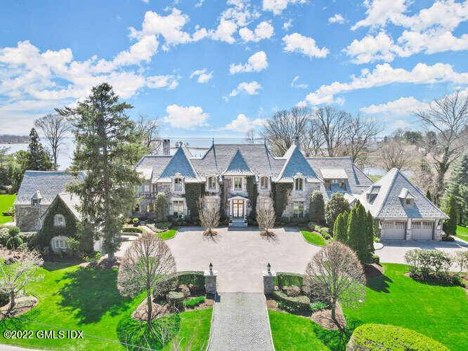 Baronial 2008 Normandy style estate with protected Long Island Sound views in the premier Indian Head Association of Riverside.