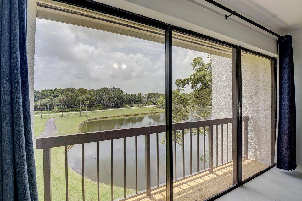 View, view, view. This lovely townhouse is situated on a serene picturesque lake.