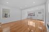Unfurnished living room with light wood-style floors, radiator, and recessed lighting