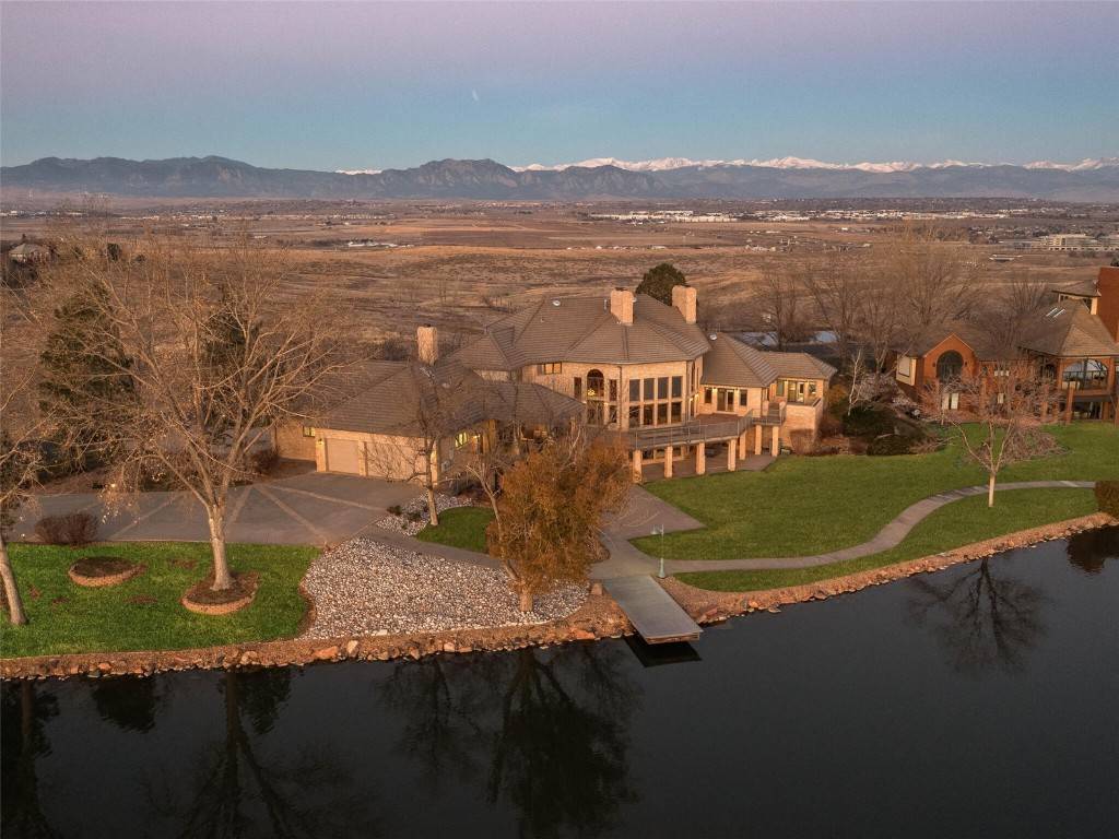 On the shores of a private lake, with majestic views of the Rocky Mountains and iconic Flatirons, this waterfront family retreat is ideal for the discerning buyer searching for a ...